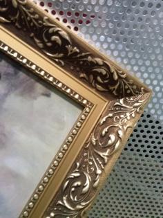 Bild mit goldfarbigen Rahmen